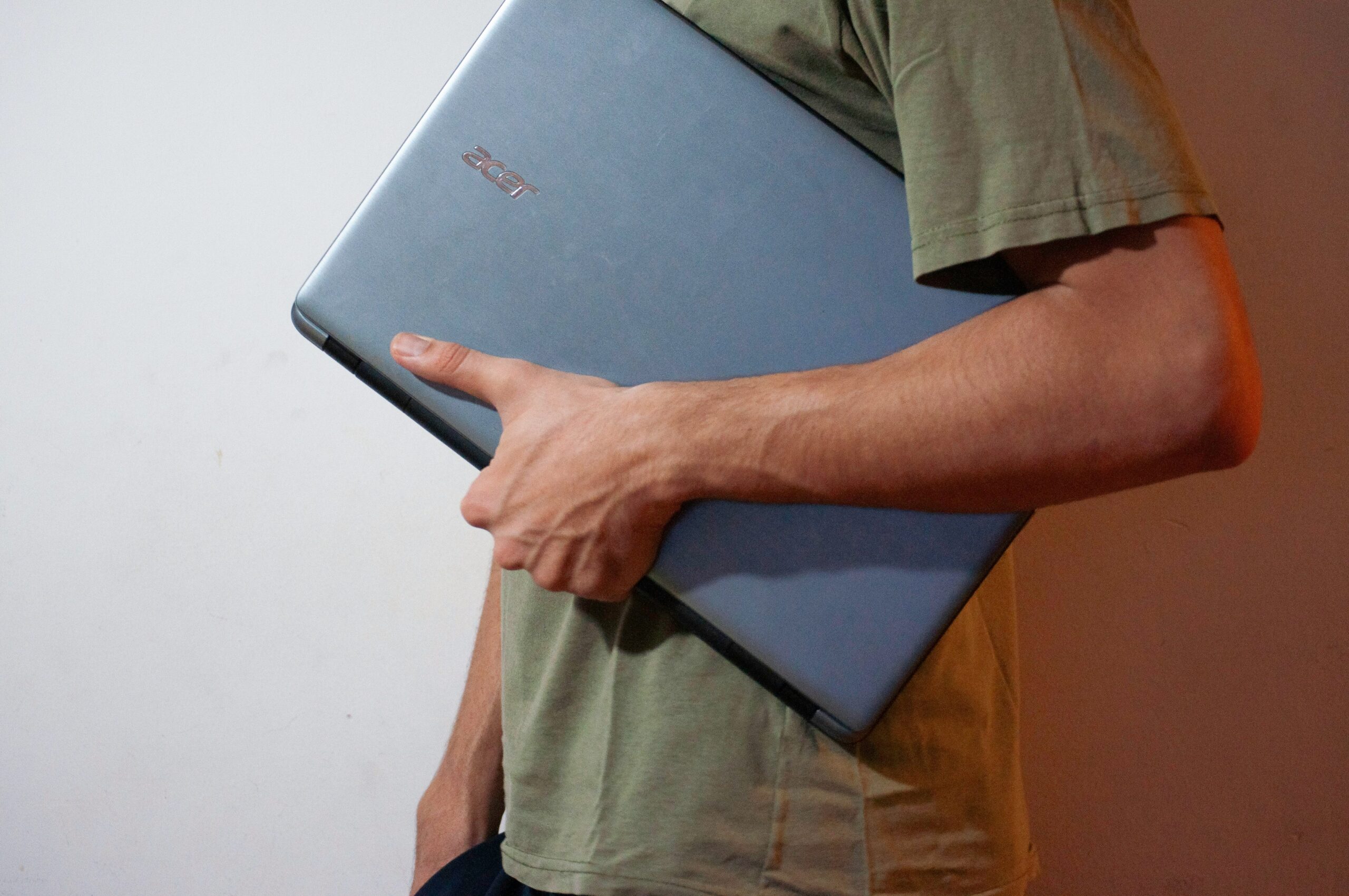 a guy holding a laptop
